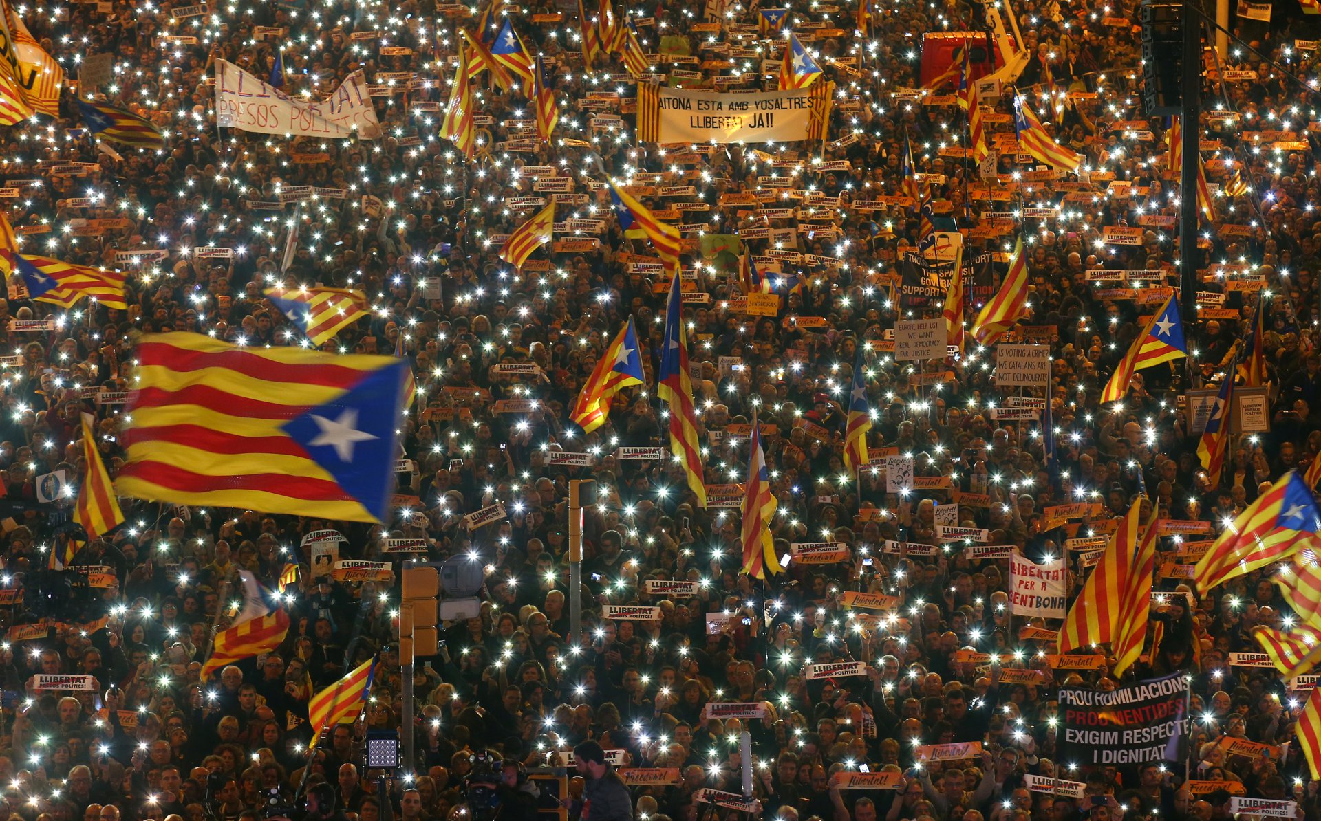 Protesters Hold The Lights Of Their Mobile Phones As They Wave Estelada Flags During A Demonstration Called By Pro Independence Associations Asking For The Release Of Jailed Catalan Activists And Leaders, In Barcelona