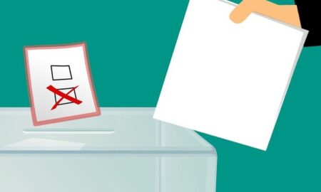 Com.it.es Votación