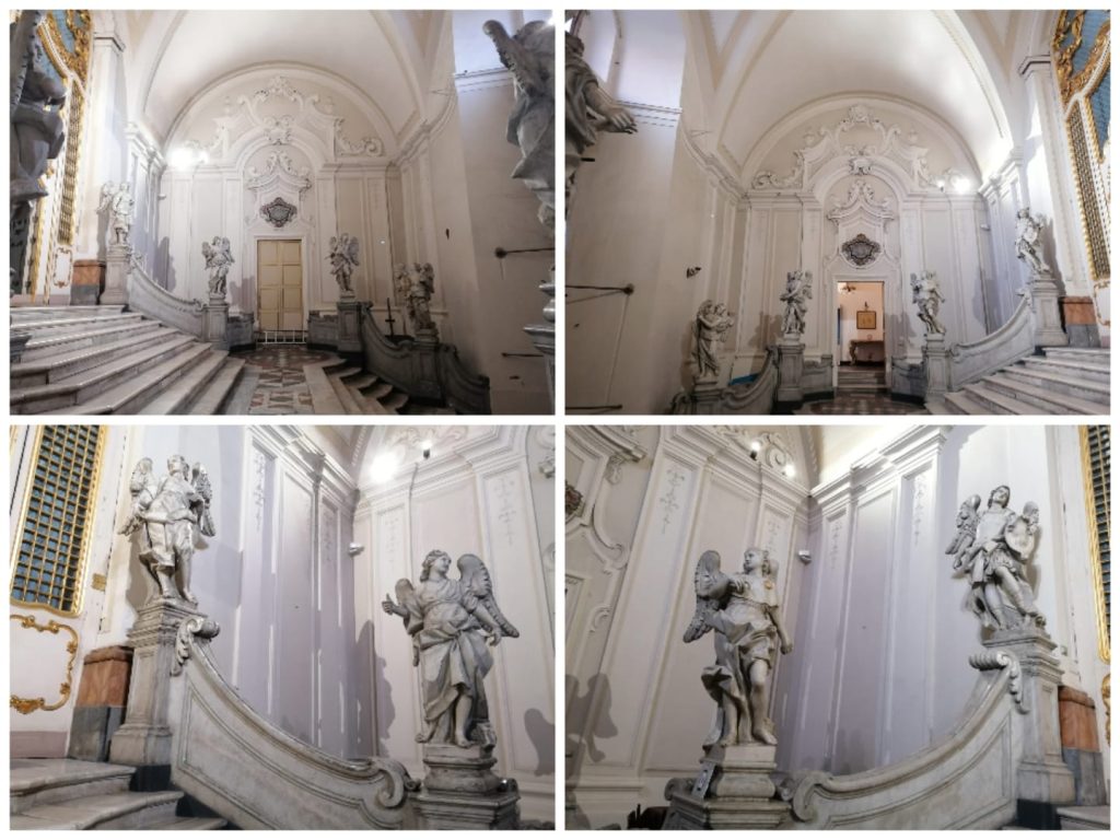 La maestosa scalinata marmorea con gli 8 angeli e gli stemmi dedicatori che immettono all'interno della Chiesa di San Benedetto