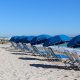 The beaches of the Po Delta - Blue umbrellas and white sand