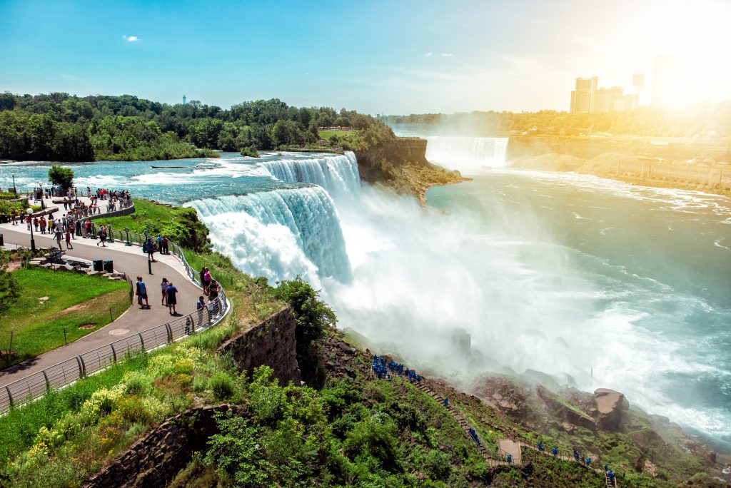 Tourists Enjoying Beautiful View To Niagara Falls During Sunny Day