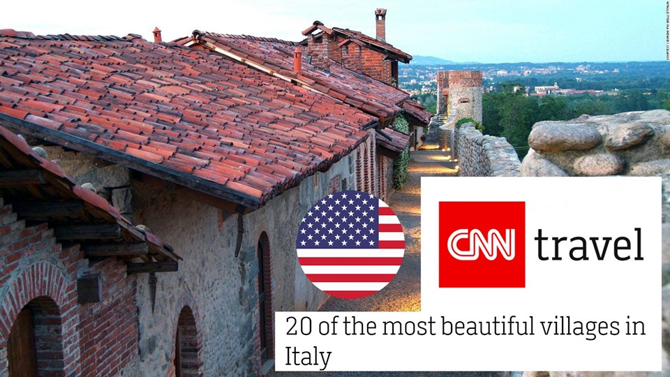 Ricetto Di Candelo al terzo posto nella classifica dei borghi della cnn, immagine dei tetti delle case con gli stemmi della cnn e della bandiera americana